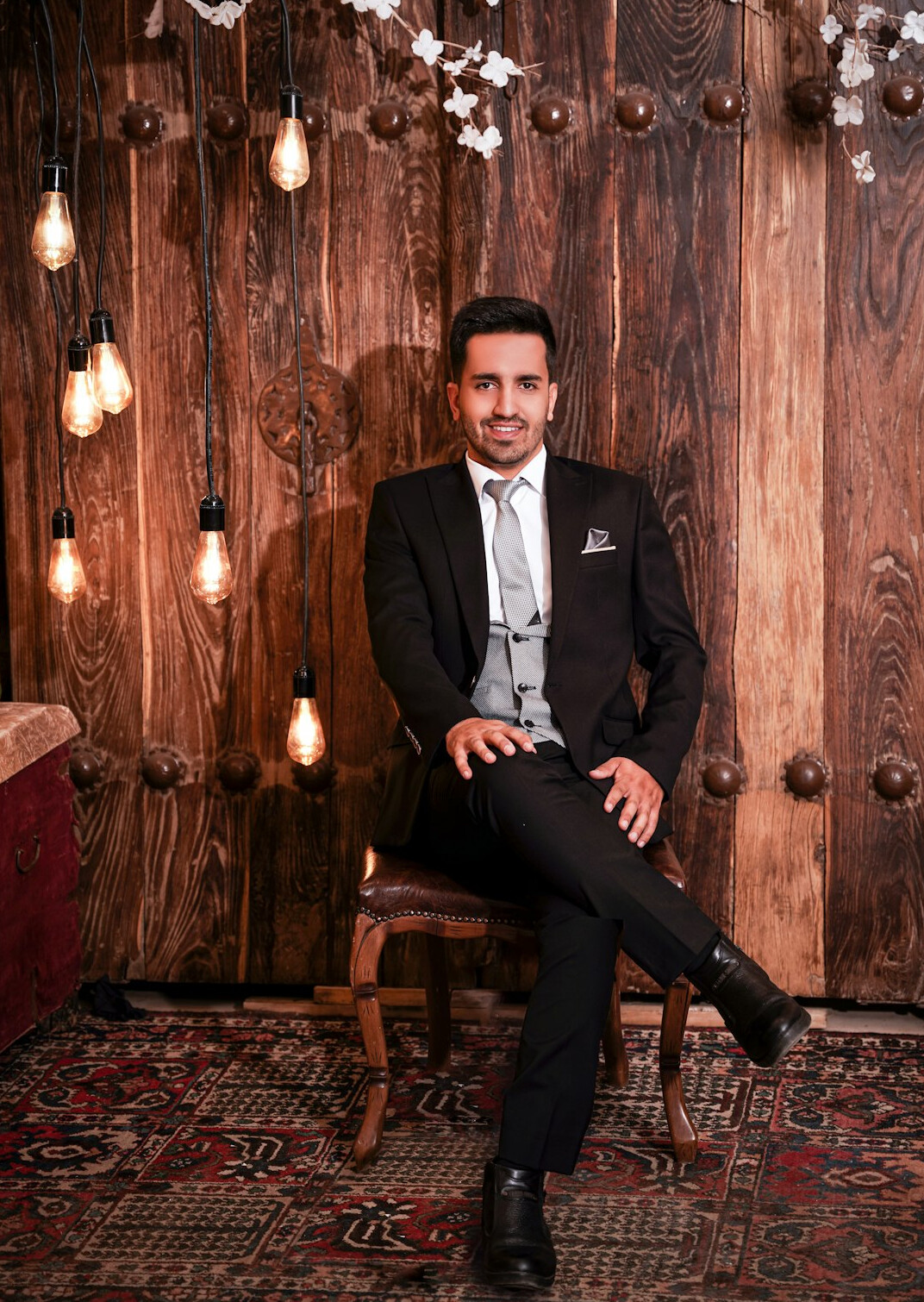 Portrait of a man in a suit with a confident smile